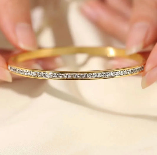 Luxe Whisper • Crystal trim gold bangle | soft flex, big light